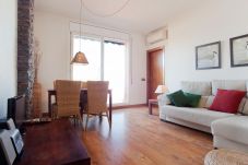 Spacious living room with access to the terrace with views of the Sagrada Família in Barcelona