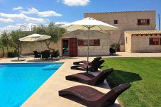 Photo of house with pool and hammocks on the lawn